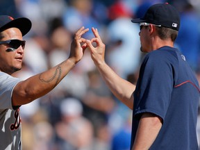 Detroit Tigers first baseman Miguel Cabrera, left, celebrates with teammate Don Kelly following Detroit's 9-4 victory over the Kansas City Royals at Kauffman Stadium in Kansas City on Sunday. (Orlin Wagner / The Associated Press)