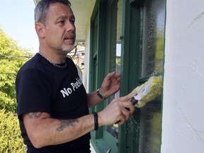 Even household chores, such as washing windows, is a workout. (ADRIAN LAM / Victoria Times Colonist files)