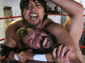 Pro wrestlers Takaaki Watanabe, above, and John Bolen train earlier this week at the Can-Am Wrestling School in Windsor. They are preparing for a big match Friday at St. Clair College in Windsor. that features east against west combatants. (DAN JANISSE / The Windsor Star)