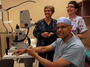 Dr. Robin Deans, seated, is joined by cataract surgery team members Kathy Moceri, behind left, and Lisa Trombley, RPN, at Ouellette Ave. Campus of Windsor Regional Hospital cataract surgery team Friday June 6, 2014. (NICK BRANCACCIO/The Windsor Star)