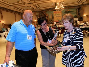 Relocated from Phoenix, Arizona, Michael and Doris Frotten talk with Helene Marwood of The Friends of Willistead during Windsor-Essex Active Retirement Community Initiative (WEARCI ) 2nd Annual Meet and Greet BBQ held at Ciociaro Club Tuesday June 10, 2014.  The event is aimed at 50-plus demographic who have relocated to any one of the nine municipalities in Windsor-Essex.  Marwood herself relocated to Windsor from Taiwan.  (NICK BRANCACCIO/The Windsor Star)