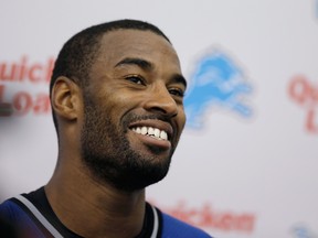 Detroit Lions receiver Calvin Johnson talks with the media. (AP Photo/Carlos Osorio, File)