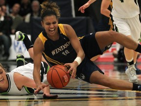 Fraser Valley's Kayli Sartori, left, battles Windsor's Miah-Marie Langlois at the 2014 CIS Women's Basketball Final 8 at the St. Denis Centre. (DAX MELMER/The Windsor Star)