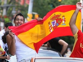 Spanish soccer fans celebrate Spain's victory over the Netherlands in the final game of the World Cup on Ouellette Avenue in Windsor on Sunday, July 11, 2010.          (TYLER BROWNBRIDGE / The Windsor Star)