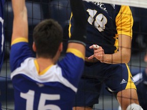 University of Windsor's Gabriel Burlacu hits a shot against the Ryerson Rams at the St. Denis Centre. (NICK BRANCACCIO/The Windsor Star)