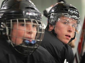 Jack Probert, left, and Kerby Rychel watch from the bench during Friday's Bob Probert Classic at Tecumseh Arena. (DAN JANISSE/The Windsor Star)