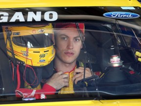 Driver Joey Logano prepares for a practice session for the NASCAR Sprint Cup series Quicken Loans 400 auto race Friday at Michigan International Speedway in Brooklyn, Mich. (AP Photo/Bob Brodbeck)
