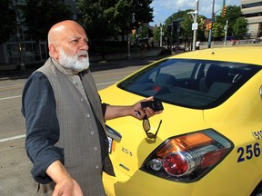 Longtime local taxi driver Aman Khan says he will be joining the street people and holding up a sign that reads "Will work for food" if things don't get better with fuel prices.  (NICK BRANCACCIO/The Windsor Star)