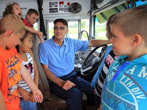 .School bus driver Charlie St. Pierre is retiring after 50 years behind the wheel. In photo, St. Pierre says his goodbyes to Grade One students at Tecumseh Vista Academy Wednesday June 18, 2014.   (NICK BRANCACCIO/The Windsor Star)