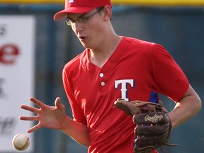 Tecumseh’s Austin Pitre fields a hit Tuesday during a 9-0 loss against the Windsor Stars in bantam major action at Cullen Field. (DAN JANISSE/The Windsor Star)