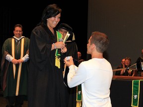 St. Clair College graduate Alysha McNamee received more than her diploma during Convocation Thursday June 19, 2014. McNamee's boyfriend Vincent Poudrier, 23, dropped to a knee and proposed to her seconds after she received congratulations from St. Clair College President Dr. John Strasser. (NICK BRANCACCIO/The Windsor Star)