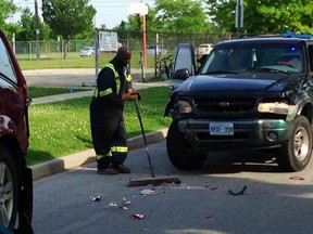 Crews clean up following a two-vehicle collision in the 1800 block of Meldrum Road in Windsor on June 9, 2014. (TwitPic: Nick Brancaccio)
