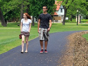 Olivia Seal, left, and Aidan Dutton, both students at Walkerville Collegiate Institute, take Willistead Park's newly paved path Monday June 02, 2014. (NICK BRANCACCIO/The Windsor Star)