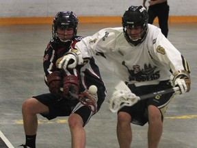 London Blue Devils' Mike Rybka (L) and Windsor Clippers' Matt Martinello battle for the ball during their game Thursday, June 5, 2014, at the Forest Glade Arena in Windsor, Ont. (DAN JANISSE/The Windsor Star)