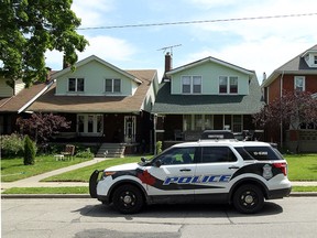 Windsor Police investigate at the scene of an alleged assault with a hammer near the corner of Church Street and Erie Street in Windsor on Friday, June 6, 2014. (Tyler Brownbridge/The Windsor Star)