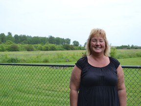 Brenda Kokko, a resident of Amherstburg's Fraserville neighbourhood, says the mosquitoes are so severe around her home she cannot use her backyard - day or night.Tall grass and weeds can be seen about 50 feet from her back fence. JULIE KOTSIS/The Windsor Star