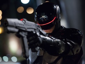 This image released by Columbia Pictures shows Joel Kinnaman in a scene from "RoboCop." (AP Photo/Columbia Pictures - Sony, Kerry Hayes)