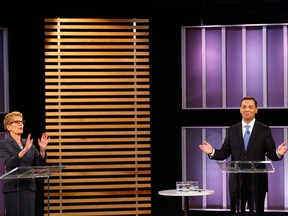 Ontario Premier Kathleen Wynne and Ontario Progressive Conservative leader Tim Hudak take part in the Ontario provincial leaders debate in Toronto, Tuesday June 3, 2014. THE CANADIAN PRESS/POOL-Mark Blinch