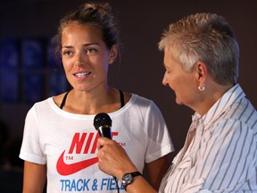 Olympic track star Melissa Bishop, left, talks with The Star's Mary Caton at The News Cafe Thursday. (NICK BRANCACCIO/The Windsor Star)