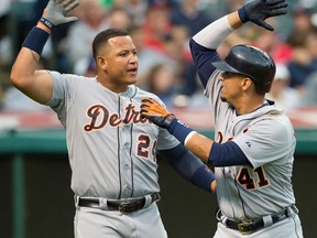 Detroit's Miguel Cabrera, left, celebrates with Victor Martinez after Martinez hit a two-run homer during the fourth inning against the Cleveland Indians at Progressive Field. (Photo by Jason Miller/Getty Images)