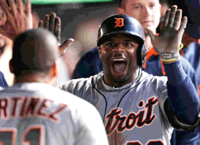 Detroit's Rajai Davis, right, is congratulated by teammates after hitting a solo home run off Cleveland Indians starting pitcher Trevor Bauer in the seventh inning in Cleveland. (AP Photo/Tony Dejak)