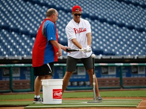 Belle River's Aaron Ekblad, right, take batting practice with former Philadelphia Phillies outfielder Matt Stairs before a game against the Miami Marlin in Philadelphia. (AP Photo/Matt Slocum)