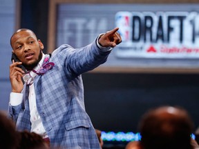 Adreian Payne of Michigan State points to fans before the start of  the 2014 NBA draft Thursday in New York. (AP Photo/Jason DeCrow)