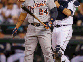 Detroit's Miguel Cabrera heads back to the dugout after striking out in the sixth inning as catcher John Buck of the Mariners throws the ball back to the pitcher at Safeco Field Saturday. (Photo by Otto Greule Jr/Getty Images)