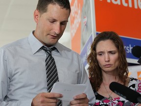 Jason Smulders and Denise Lafontaine hold photos of Alyssa Smulders, 13, and Marc Lafontaine, 35, who both died on the 401 May 10, 2014.   Jason and Denise held a press conference to make a push for concrete barriers on highway 401to prevent future accidents.