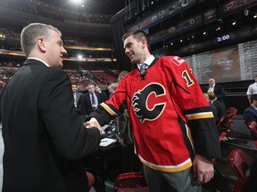 Hunter Smith, right, meets his team after being selected 54th by the Calgary Flames on Day 2 of the 2014 NHL Draft at the Wells Fargo Center on June 28, 2014 in Philadelphia.  (Photo by Bruce Bennett/Getty Images)