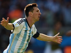 Argentina's Lionel Messi celebrates after scoring a goal during a Group F match against Iran at the Mineirao Stadium in Belo Horizonte during the 2014 FIFA World Cup in Brazil on June 21, 2014. (PEDRO UGARTE/AFP/Getty Images)