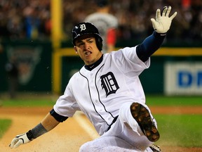 Detroit's Jose Iglesias slides into home against the Boston Red Sox at Comerica Park. (Photo by Jamie Squire/Getty Images)