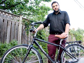 Adriano Ciotoli from WindsorEats stands with a 2013 Trek Allants bike at his Walkerville neighbourhood home Sunday, June 22, 2014. Five Trek bikes were stolen from his garage early Sunday morning. (JOEL BOYCE/The Windsor Star)