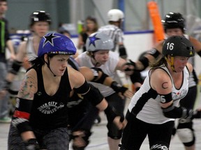 The Border City Brawlers All-Stars and the Tri City Plan B prepare for a jam at Aidie Knox Arena, Saturday, June 28, 2014. (RICK DAWES/The Windsor Star)