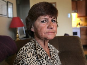 Brenda Schmidt says she was kicked off a Transit Windsor bus for complaining to fellow passenger about bus being 30 minutes late. She is shown Thursday, June 11, 2014, at her Windsor, Ont. apartment. (DAN JANISSE/The Windsor Star)