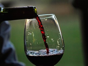 A man pours a glass of Chilean wine. (Associated Press files)