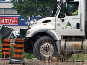 Construction work continues on the Parkway in front of Dainty Foods in Windsor on Thursday, June 19, 2014. Dainty foods will collect millions in compensation from the government for dealing with the construction.                (Tyler Brownbridge/The Windsor Star)