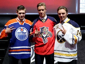 Leon Draisaitl, from left, third overall pick by the Edmonton Oilers, Aaron Ekblad first overall pick by the Florida Panthers and Sam Reinhart the second overall pick by the Buffalo Sabres pose during the first round of the 2014 NHL Draft at the Wells Fargo Center on June 27, 2014 in Philadelphia, Pennsylvania.  (Photo by Bruce Bennett/Getty Images)