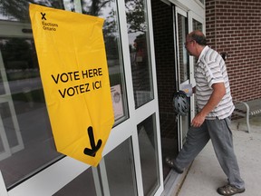 A voter enters the polling station at the Adie Knox Herman Community Centre in Windsor West, Thursday, June 12, 2014.  (DAX MELMER/The Windsor Star)