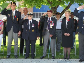 From left, veteran Wilford Renaud, Dorothy Grondin, Veteran Ralph Mayville, Catherine O'Brien-Hart, wife of the late Michigan Senator, George Hart, and Armand Rock of the Windsor Regiment, attend a ceremony put on by the Windsor Veterans Memorial Services Committee at the Cenotaph at City Hall, Sunday, June 1, 2014.  The committee honours veterans and comrades who have passed in the last year.  (DAX MELMER/The Windsor Star)