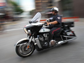 There is a large police presence downtown for the big fireworks show including this offficer on a motorcycle.  (DAN JANISSE/The Windsor Star)