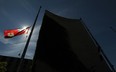 The flags at City Hall Square in downtown Windsor, Ont. are pictured at half mast in this 2011 file photo. (DAX MELMER/The Windsor Star)