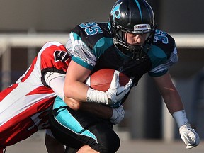 Essex's running back, Eli Fera, rushes for a gain as the Essex Ravens host the Mississauga Warriors at Alumni Field, Saturday, June 7, 2014.  (DAX MELMER/The Windsor Star)