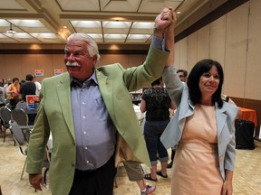 NDP MPP Percy Hatfield, left, congratulates Lisa Gretzky on her first victory at the Caboto Club in Windsor on Thursday, June 12, 2014.               (Tyler Brownbridge/The Windsor Star)