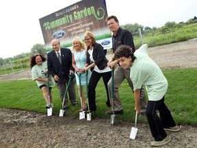 Lorraine Bondy, Ed  Sleiman, June Muir, Shaun Whitehead, Chris Taylor and Gabe Bondy (left to right) each put a shovel in the ground during the official opening of the new community garden at the Unemployed Help Centre in Windsor on Tuesday, June 24, 2014. The 1.6 acre piece of land is being donated by Ford and will allowed the centre to have twice as many plots as they currently have.                (Tyler Brownbridge/The Windsor Star)
