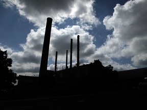 The afternoon sun silhouettes the smoke stacks on the Heinz plant in Leamington on Thursday, June 26, 2014. (Tyler Brownbridge/The Windsor Star)