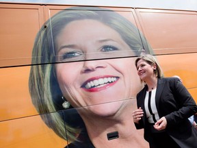 Ontario NDP leader Andrea Horwath walks by her campaign bus on June 4, 2014. (Darren Calabrese / The Windsor Star)
