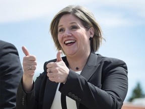 Ontario NDP leader Andrea Horwath gives a double thumbs-up on June 4, 2014. (Darren Calabrese / The Canadian Press)