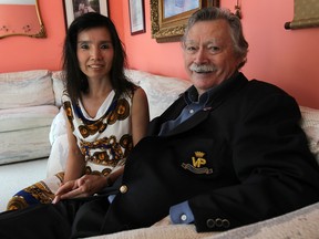 Vince Courtenay will be travelling to Ottawa soon to receive an award for his service in the Korean War. The veteran is shown Wednesday, June 25, 2014, at his Windsor, Ont. home. with his wife Makye Courtenay.(DAN JANISSE/The Windsor Star)