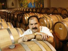 Carlo Negri, master winemaker with Colio Estate Wines, stands amidst a sea of barrels in the Harrow vineyard warehouse on  June 12, 2001.  (Windsor Star files)